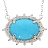 Oval blue turquoise sterling silver necklace with sparkling gemstone accents, perfect for elegant style.