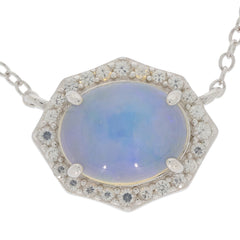Elegant White Opal pendant necklace set in sterling silver with sparkling accents. A timeless piece of luxury jewelry.