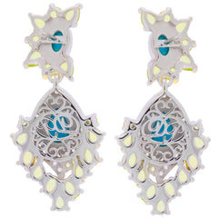 Elegant pear blue turquoise sterling silver earrings with intricate design and accent stones for a luxurious look.