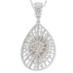 Elegant sterling silver pendant in a teardrop shape featuring intricate filigree design and a stunning gemstone.