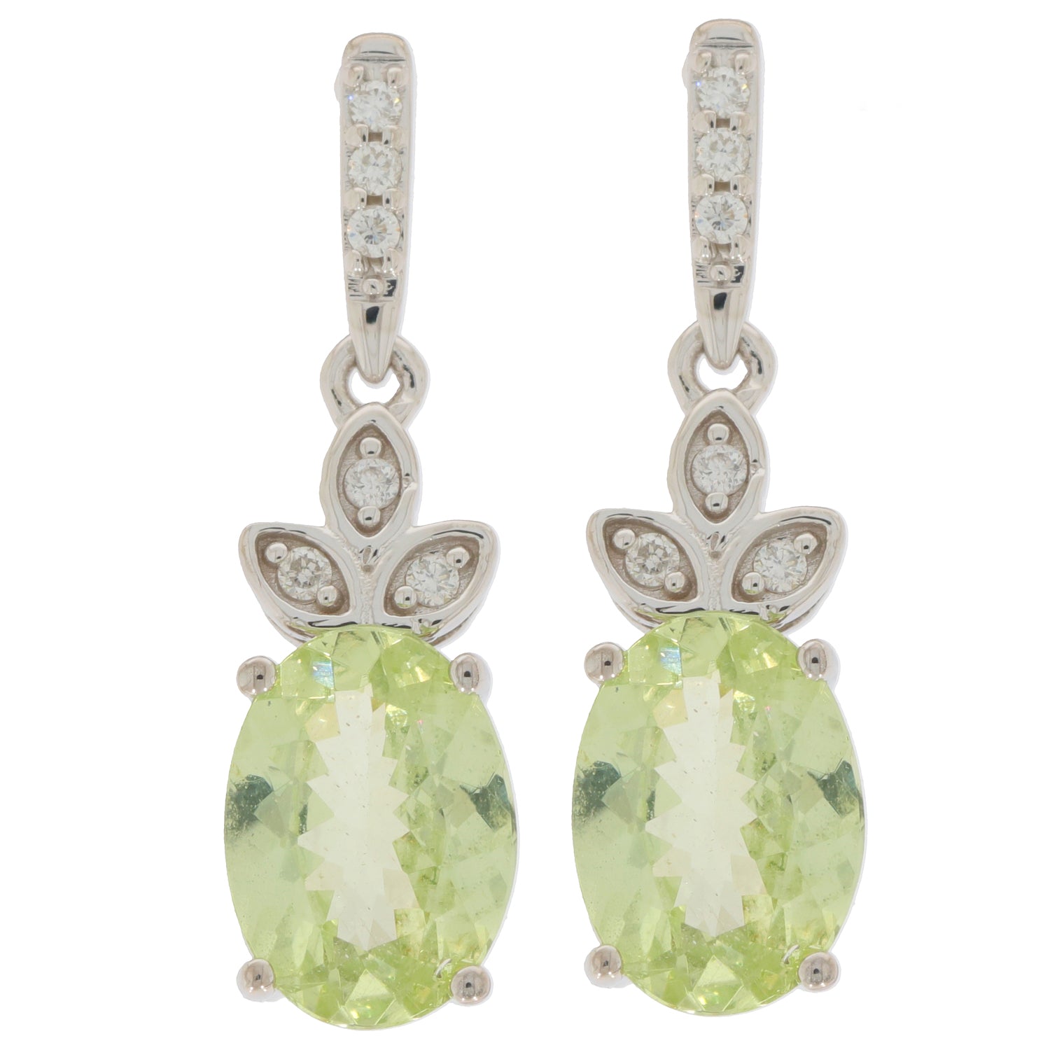 Oval green peridot earrings set in 14K white gold with diamond accents, showcasing elegant design and sparkle.