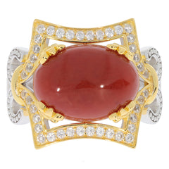 Oval red coral sterling silver ring with sparkling accents, showcasing elegance and luxury in a sophisticated design.
