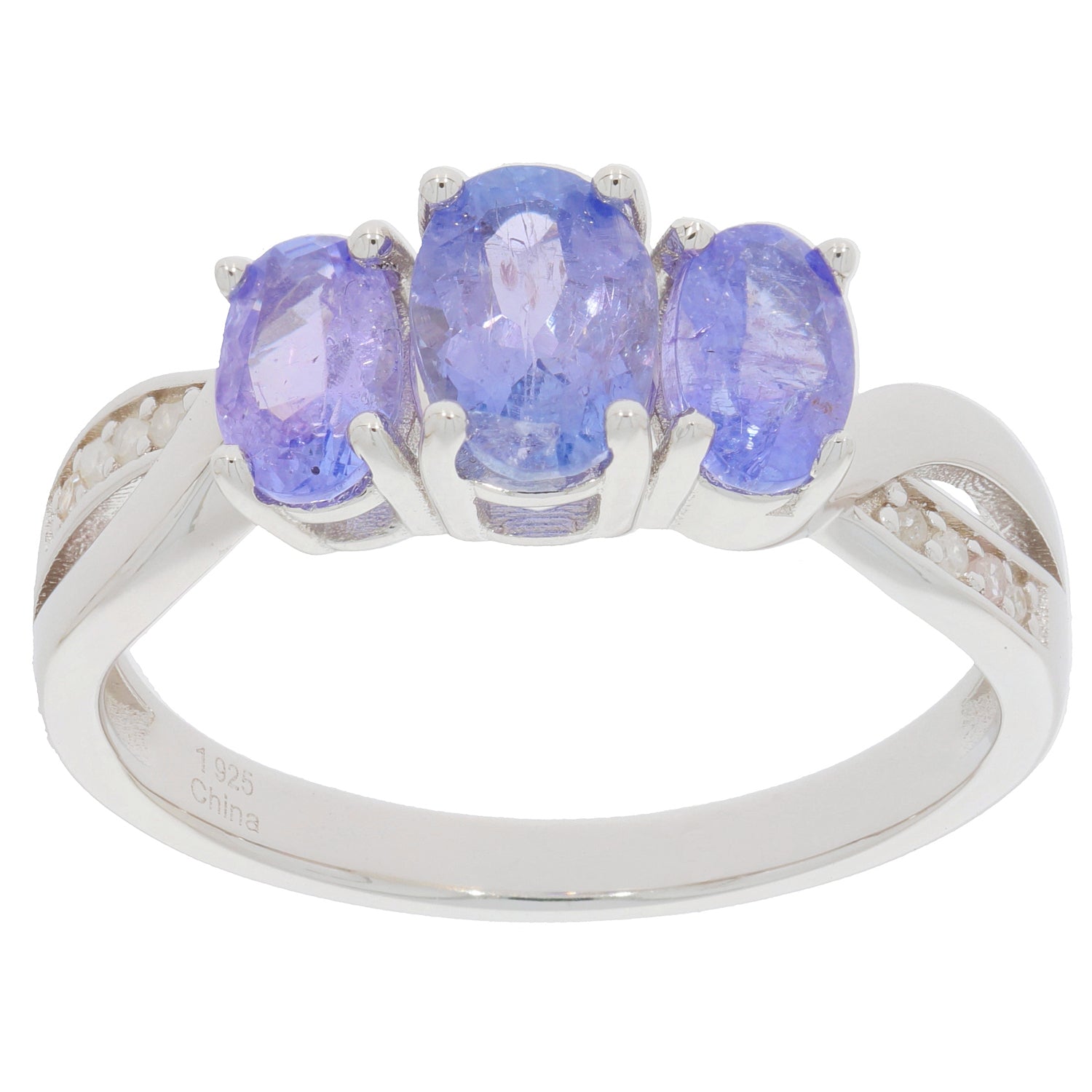 Oval blue tanzanite sterling silver ring with three gemstones, showcasing luxury and elegance.