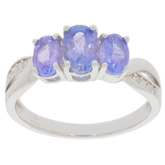 Oval blue tanzanite sterling silver ring with three gemstones, showcasing luxury and elegance.