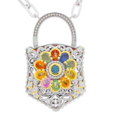 Multiple color sapphire and garnet sterling silver pendant with floral design and intricate detailing.