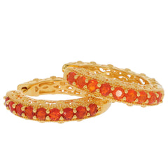 Elegant gold earrings featuring vibrant orange gemstones, perfect for adding a touch of luxury to any outfit.
