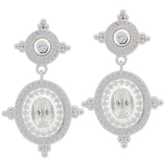 Oval white Moissanite sterling silver earrings with accent, featuring elegant design and sparkling gemstones.