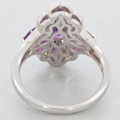 Elegant oval purple amethyst sterling silver ring viewed from behind, showcasing intricate design and sparkling gemstone.
