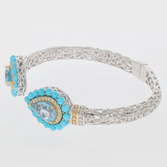 Elegant Pear Blue Topaz Sterling Silver Bracelet with Turquoise accents and intricate filigree design.