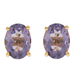 Oval purple sapphire earrings in sterling silver, showcasing brilliance and elegance with gold accents.