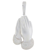 Elegant diamond-accented silver pendant in the shape of clasped hands, embodying luxury and style.