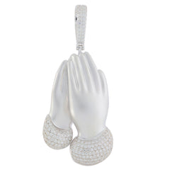 Elegant diamond-accented silver pendant in the shape of clasped hands, embodying luxury and style.