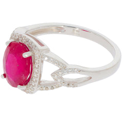 Elegant oval red ruby sterling silver ring with sparkling accents, perfect for luxurious style and sophistication.