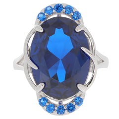 Elegant oval blue sapphire ring in sterling silver with accent stones, radiating luxury and sophistication.