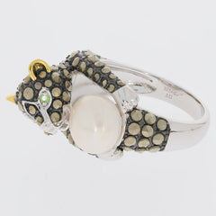 Unique sterling silver ring featuring a bear design with black stones, a pearl, and green accents. Perfect for animal lovers.