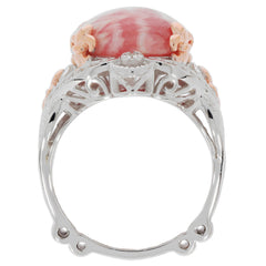 Elegant oval red coral sterling silver ring with accent details, showcasing luxury and sophistication.