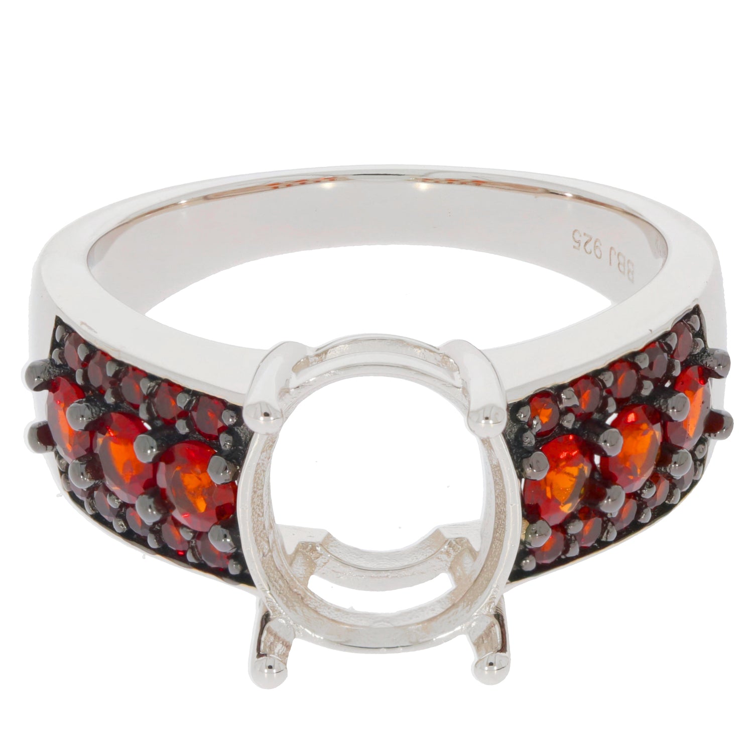 Oval red garnet sterling silver ring with accent gemstones, showcasing elegant design and luxury style.