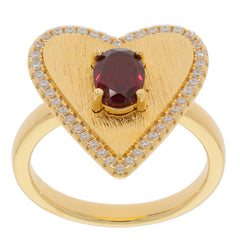Heart-shaped gold ring featuring an oval red garnet center stone surrounded by sparkling accents.