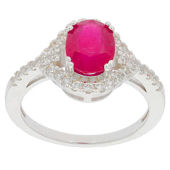 Oval red ruby sterling silver ring with accent stones, showcasing elegance and luxury in jewelry.