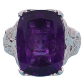 Purple Amethyst sterling silver ring featuring a large gemstone with elegant floral accents.