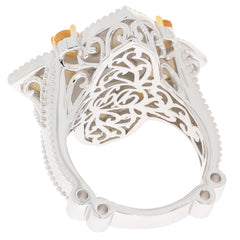 Elegant blue turquoise sterling silver ring with intricate design and sparkling accents.