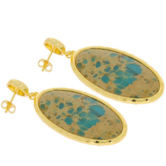 Oval blue turquoise sterling silver earrings with gold accents, showcasing sparkling gemstones for elegant style.