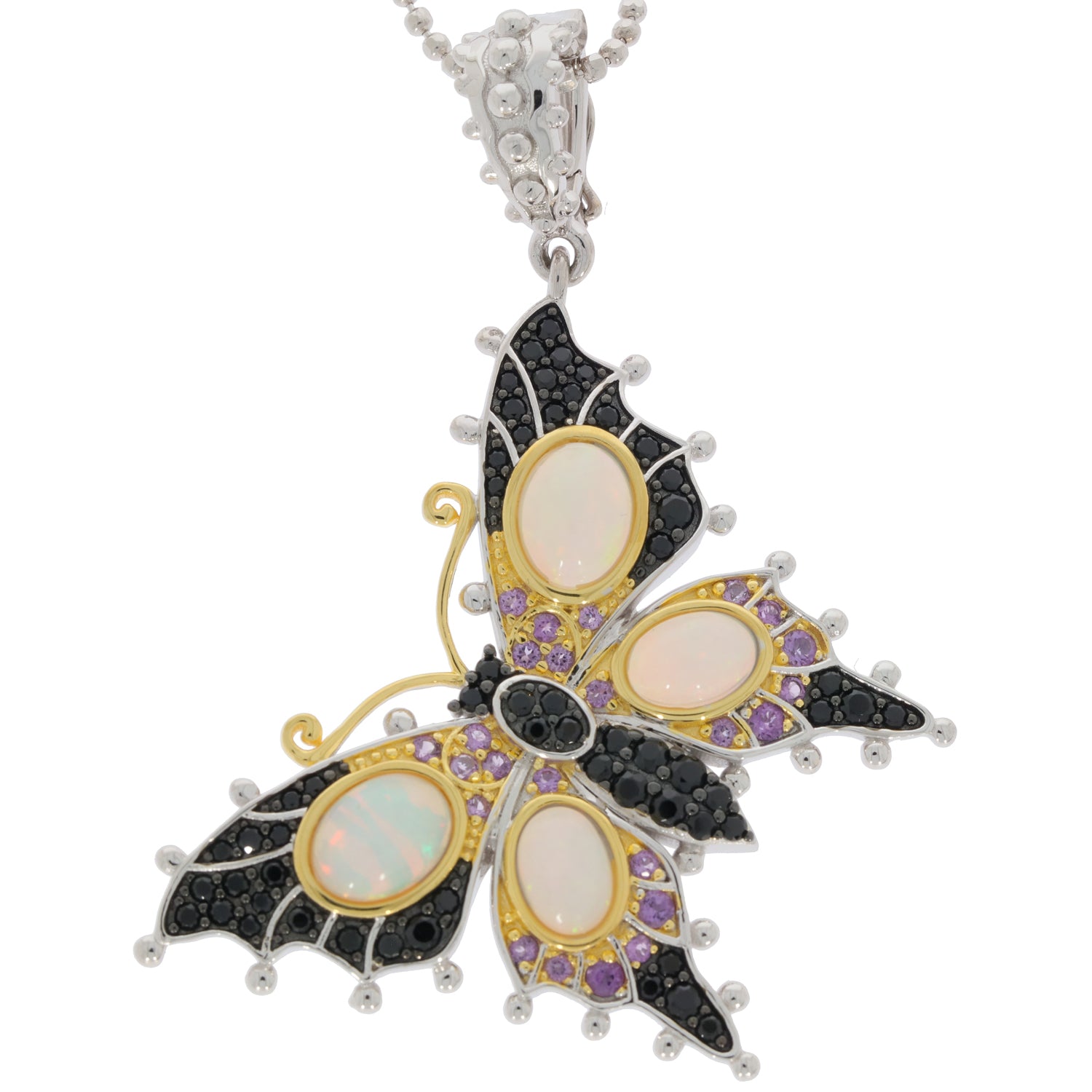 Elegant butterfly pendant featuring white opal, purple spinel, and black gemstones in sterling silver.