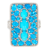 Oval blue turquoise sterling silver ring with gemstone accents, showcasing vibrant blue hues and exquisite craftsmanship.
