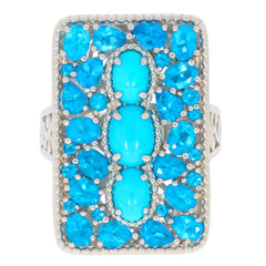 Oval blue turquoise sterling silver ring with gemstone accents, showcasing vibrant blue hues and exquisite craftsmanship.