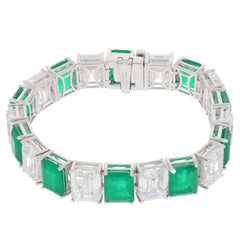 Green Emerald Sterling Silver Bracelet with Moissanite accents, showcasing elegant design and luxurious gemstones.
