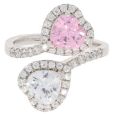 Heart-shaped pink sapphire ring with moissanite accents in sterling silver, showcasing elegant dual-tone design.