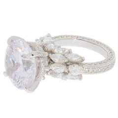 Elegant round white Moissanite sterling silver ring with sparkling accent gemstones.