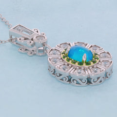 Oval blue opal sterling silver pendant with accent gemstones, showcasing elegant design and luxury craftsmanship.