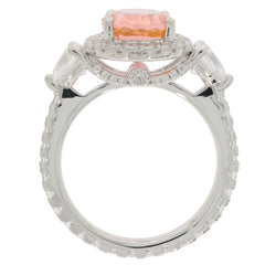 Pink Morganite sterling silver ring with accent stones, featuring a sparkling central gemstone and elegant design.