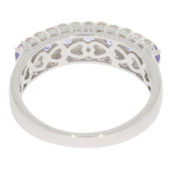 Blue Tanzanite Sterling Silver Ring with intricate heart design on the band and sparkling gemstone accents.
