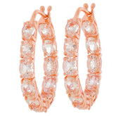 Elegant rose gold hoop earrings featuring sparkling clear gemstones, perfect for adding glamour to any outfit.