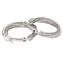 Round white diamond sterling silver earrings featuring a sparkling gemstone accent and elegant design.