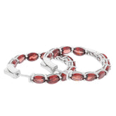Oval Red Garnet Sterling Silver Earrings showcasing elegant gemstones in a sophisticated design.