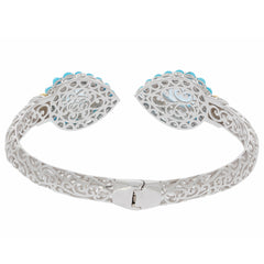 Elegant Pear Blue Topaz Sterling Silver Bracelet with detailed filigree design and turquoise accents.