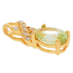 14K yellow gold pendant featuring a green peridot gemstone and diamond accent for elegant style.