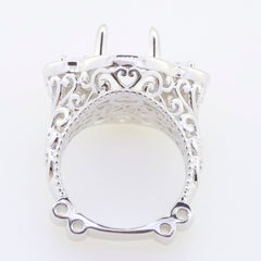 Elegant silver ring setting showcasing intricate filigree design, perfect for holding a turquoise gemstone.