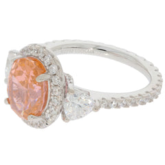 Elegant pink Morganite sterling silver ring with accent stones, showcasing exquisite gemstone brilliance.