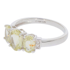 14K white gold ring featuring four oval yellow gemstones and diamond accents, a blend of elegance and luxury.