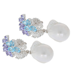 Elegant white pearl sterling silver earrings with gemstone accents, perfect for adding luxury to any outfit.