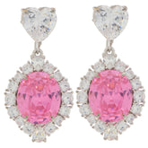 Elegant pink sapphire drop earrings with heart-shaped accents and sparkling white gemstones.