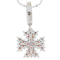 Sterling silver cross pendant with intricate design, showcasing a polished finish and detailed accents.
