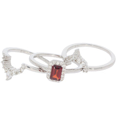 Emerald red garnet sterling silver ring with accent stones, showcasing elegance and sophistication.