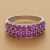 Elegant pink sapphire sterling silver ring with a sparkling gemstone design, showcasing luxury and sophistication.