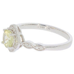 Green Peridot 14K white gold ring with diamond accent, showcasing elegant design and sparkling gemstones.