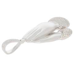 Elegant sterling silver pendant in the shape of two hands, adorned with sparkling white diamonds.